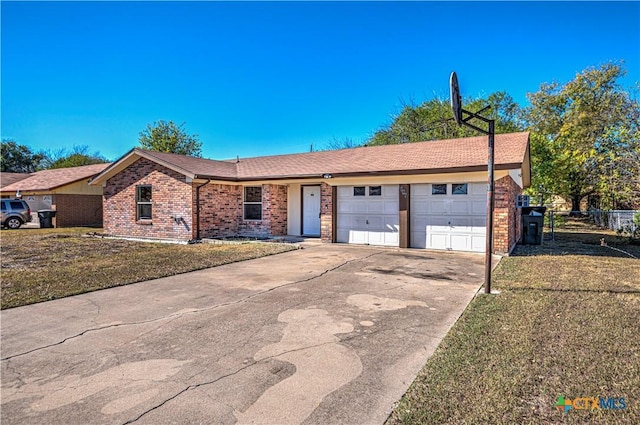 single story home with a front yard and a garage