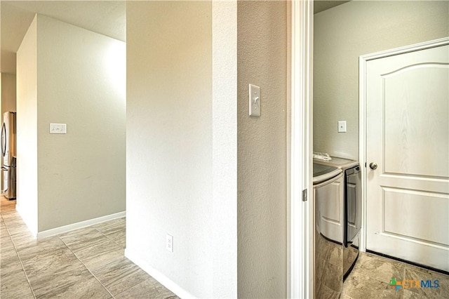 2002 Hayes St, Temple, TX 76502 - hall with baseboards and washing machine and dryer