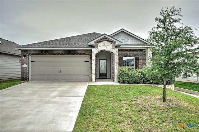 2002 Hayes St, Temple, TX 76502 - single story home with brick siding, a garage, a front yard, and concrete driveway