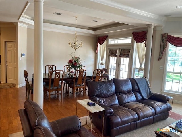 104 Woodcreek Cir, Victoria, TX 77904 - living area with ornate columns, a tray ceiling, ornamental molding, wood finished floors, and baseboards