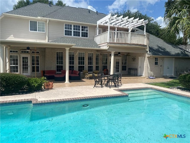 104 Woodcreek Cir, Victoria, TX 77904 - rear view of house featuring a pergola, outdoor lounge area, an outdoor pool, and a patio