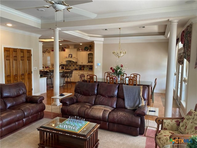 104 Woodcreek Cir, Victoria, TX 77904 - living room featuring ornate columns, ceiling fan, ornamental molding, and a tray ceiling
