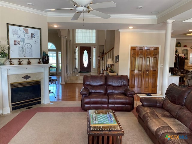104 Woodcreek Cir, Victoria, TX 77904 - living room with ornate columns, ceiling fan, ornamental molding, wood finished floors, and stairway