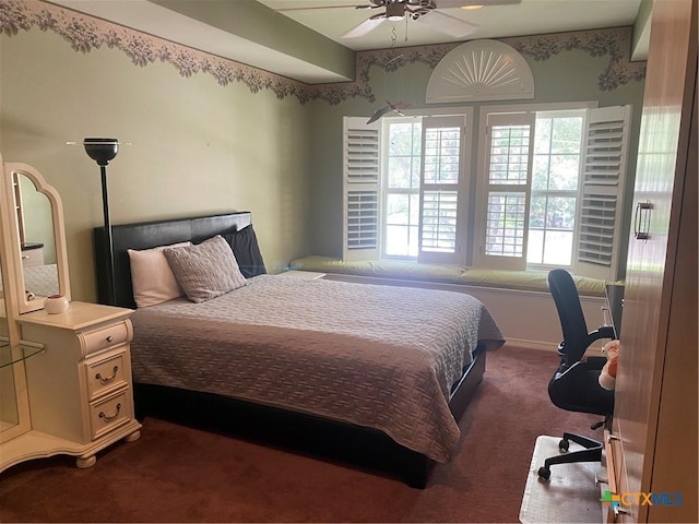 104 Woodcreek Cir, Victoria, TX 77904 - bedroom with dark carpet, a ceiling fan, and baseboards
