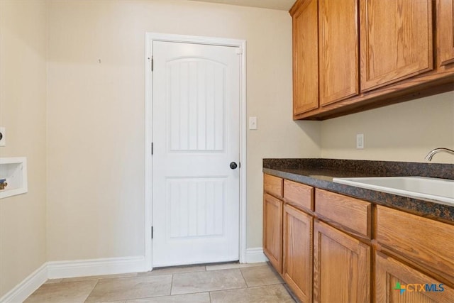 1129 Wren Cir, Copperas Cove, TX 76522 - laundry area featuring cabinet space, washer hookup, light tile patterned floors, and hookup for an electric dryer