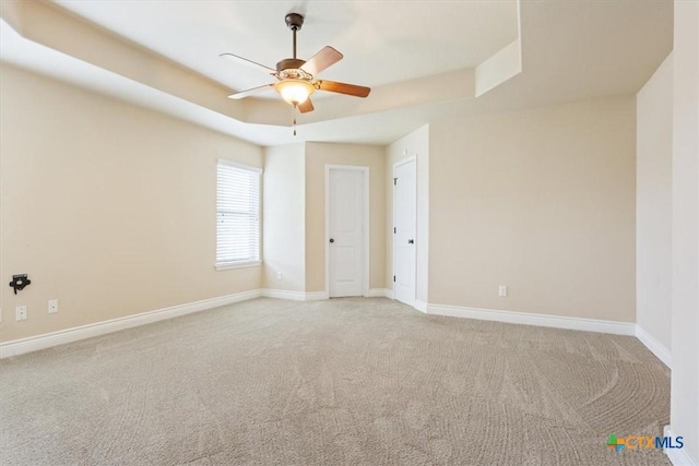 1129 Wren Cir, Copperas Cove, TX 76522 - empty room with light carpet, ceiling fan, and a raised ceiling