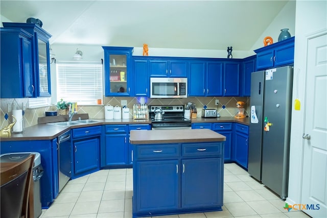 kitchen featuring a kitchen island, blue cabinets, sink, and appliances with stainless steel finishes