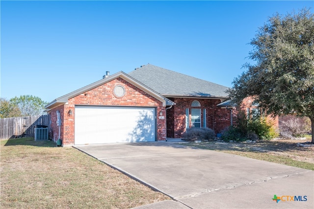 view of front of house featuring a garage and a front yard