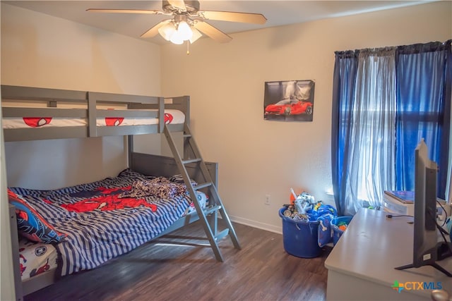 bedroom featuring ceiling fan and dark hardwood / wood-style flooring