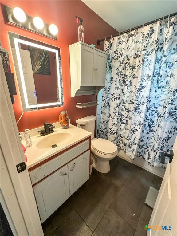 2503 E Mistletoe Ave, Victoria, TX 77901 - bathroom with tile patterned floors and vanity