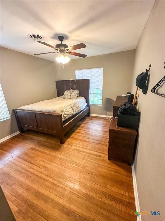 2503 E Mistletoe Ave, Victoria, TX 77901 - bedroom with light wood finished floors and ceiling fan