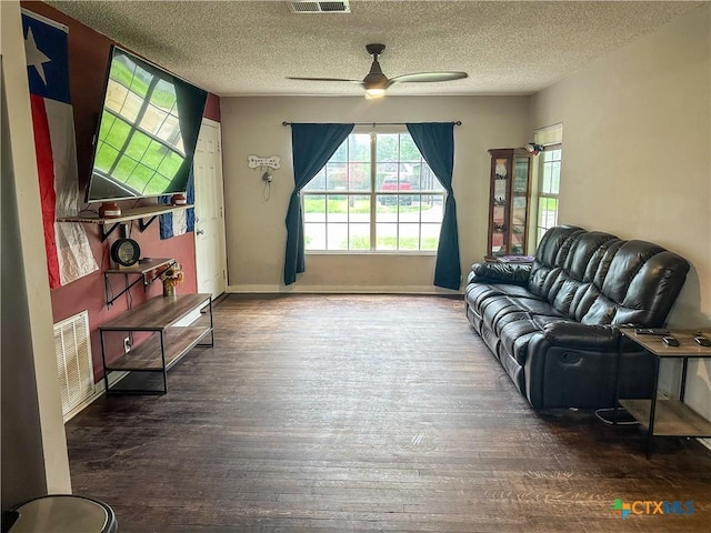 2503 E Mistletoe Ave, Victoria, TX 77901 - living room with wood finished floors, a ceiling fan, and a textured ceiling