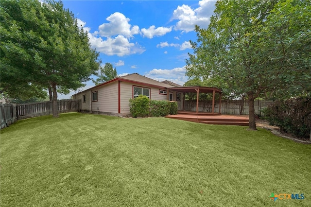 view of yard with a deck