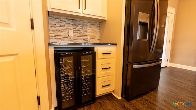 kitchen with white cabinets, backsplash, wine cooler, refrigerator with ice dispenser, and dark hardwood / wood-style flooring