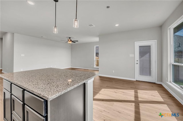 carpeted empty room with ceiling fan and vaulted ceiling