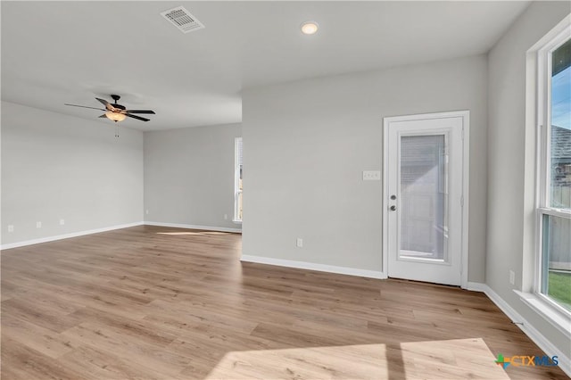 spare room featuring ceiling fan and light wood-type flooring