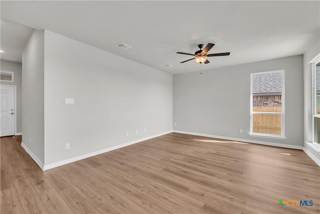 spare room with ceiling fan and light hardwood / wood-style floors