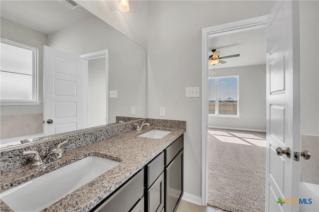 bathroom with ceiling fan and vanity