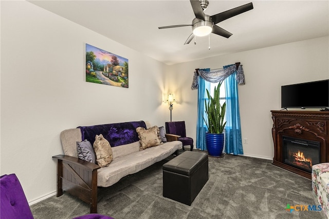 3946 Legend Pond, New Braunfels, TX 78130 - carpeted living area with ceiling fan, a glass covered fireplace, and baseboards