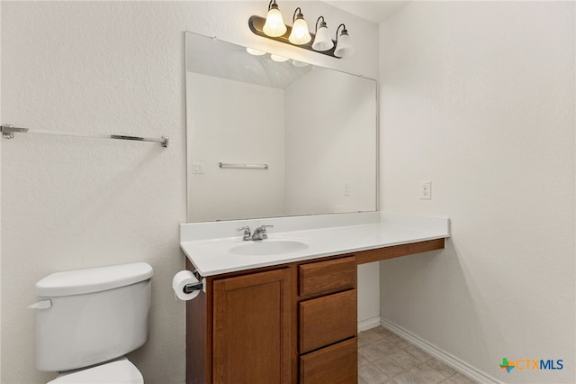 3946 Legend Pond, New Braunfels, TX 78130 - bathroom featuring vanity, toilet, and baseboards