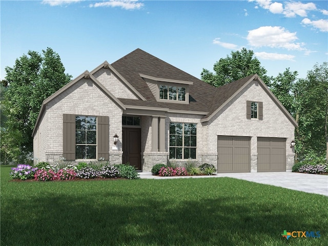 view of front facade with a garage and a front lawn