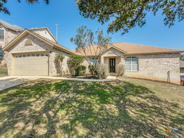 ranch-style house featuring driveway, an attached garage, a front lawn, and brick siding