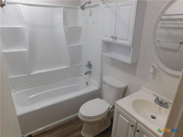 4902 Meyers Ln, Waco, TX 76705 - full bath featuring toilet, bathtub / shower combination, vanity, and wood finished floors