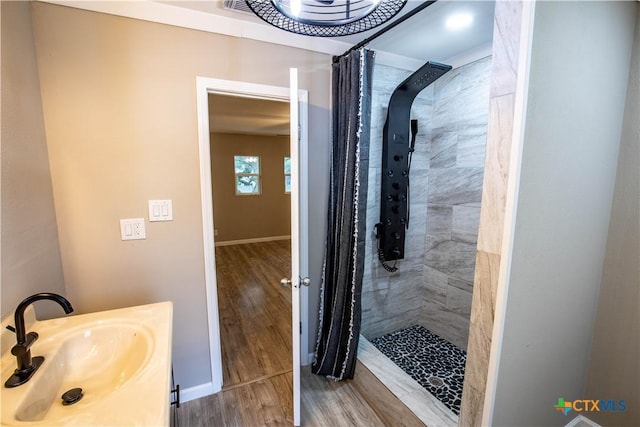 bathroom with vanity, hardwood / wood-style floors, and a shower with curtain