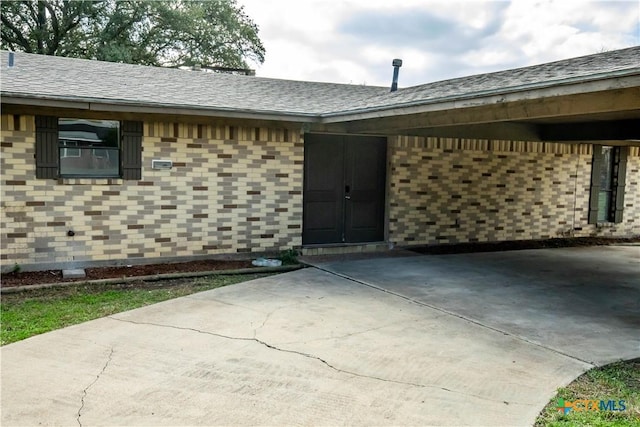 property entrance with a patio area