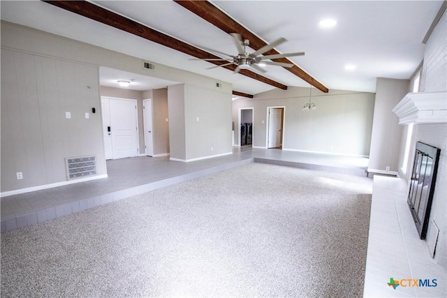 unfurnished living room with vaulted ceiling with beams, ceiling fan with notable chandelier, light colored carpet, and a fireplace