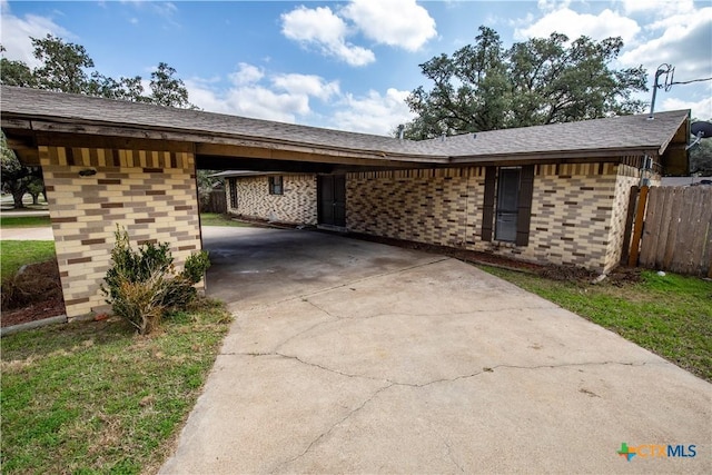 view of front of property with a carport