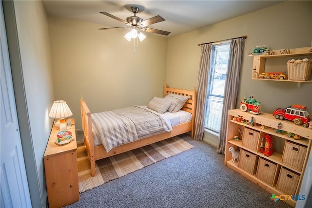 carpeted bedroom featuring ceiling fan