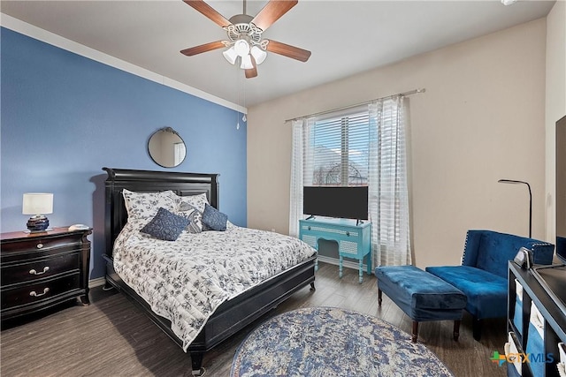 bedroom with hardwood / wood-style flooring and ceiling fan