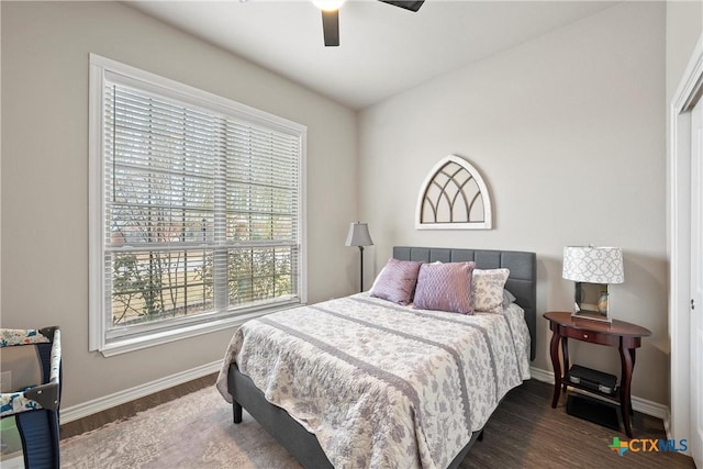 bedroom with dark wood-type flooring and ceiling fan