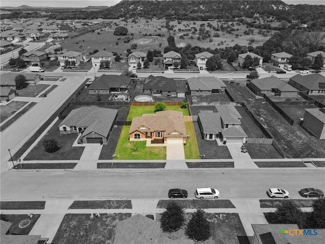 birds eye view of property with a residential view and a mountain view