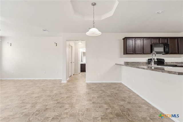 kitchen with dark brown cabinets, baseboards, visible vents, decorative light fixtures, and black appliances
