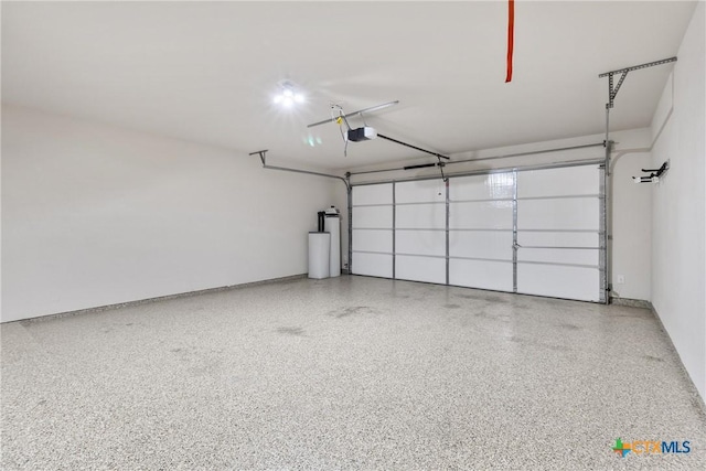 garage featuring baseboards and a garage door opener