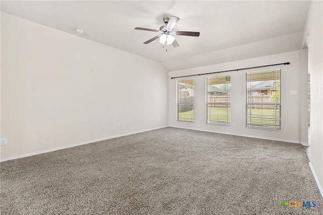 spare room with a ceiling fan, baseboards, carpet floors, and a healthy amount of sunlight