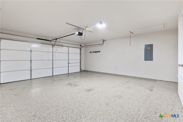 garage featuring electric panel and a garage door opener