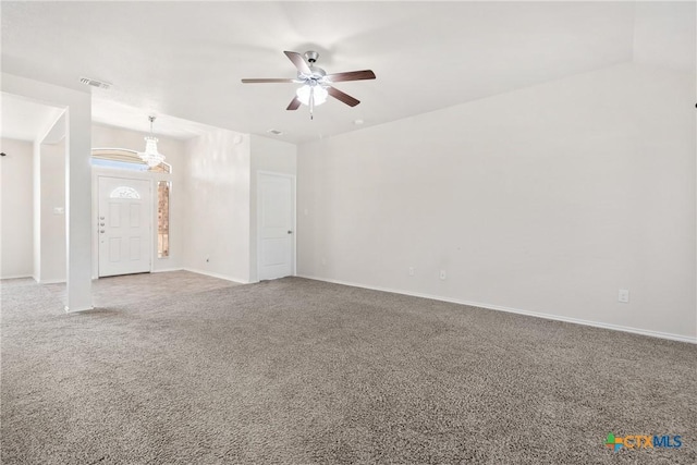 unfurnished living room featuring carpet, visible vents, a ceiling fan, and baseboards