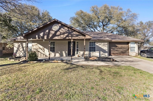 single story home featuring a garage, concrete driveway, brick siding, and a front lawn