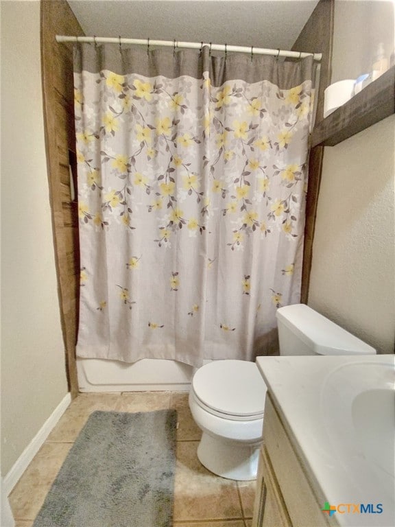 full bath featuring toilet, tile patterned flooring, vanity, and shower / bathtub combination with curtain