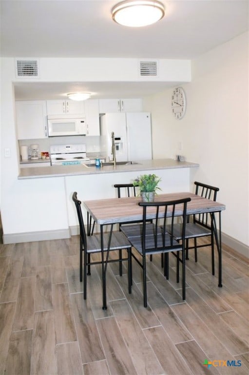 dining space with sink