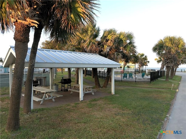 view of property's community with a gazebo and a yard