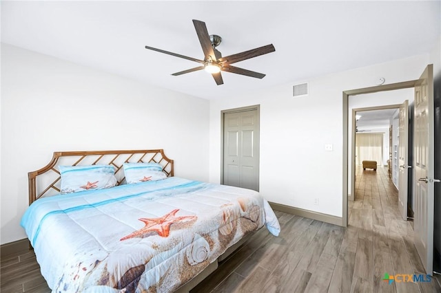 bedroom featuring wood-type flooring and ceiling fan