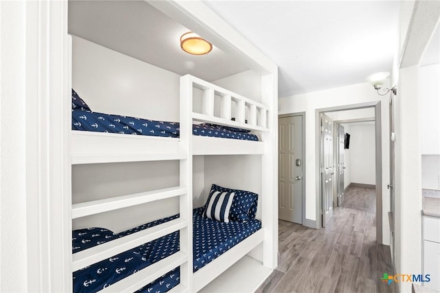 bedroom with wood-type flooring