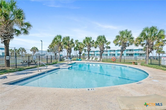 view of swimming pool with a patio area