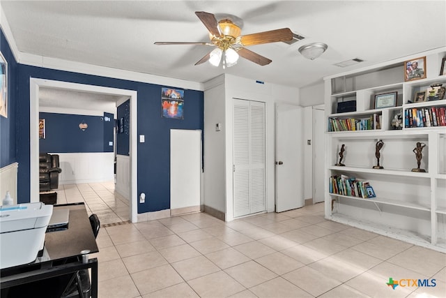 office space with light tile patterned flooring, ceiling fan, and crown molding