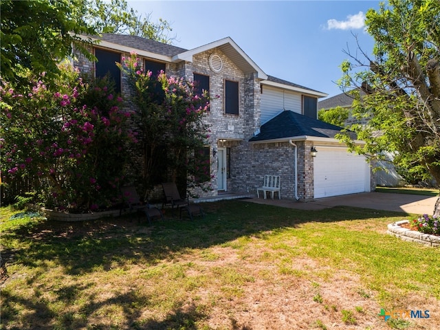 view of front facade featuring a garage and a front lawn