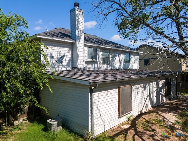 back of house featuring central air condition unit